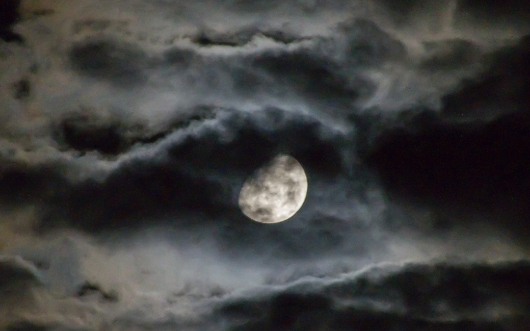 moon peeping through the clouds